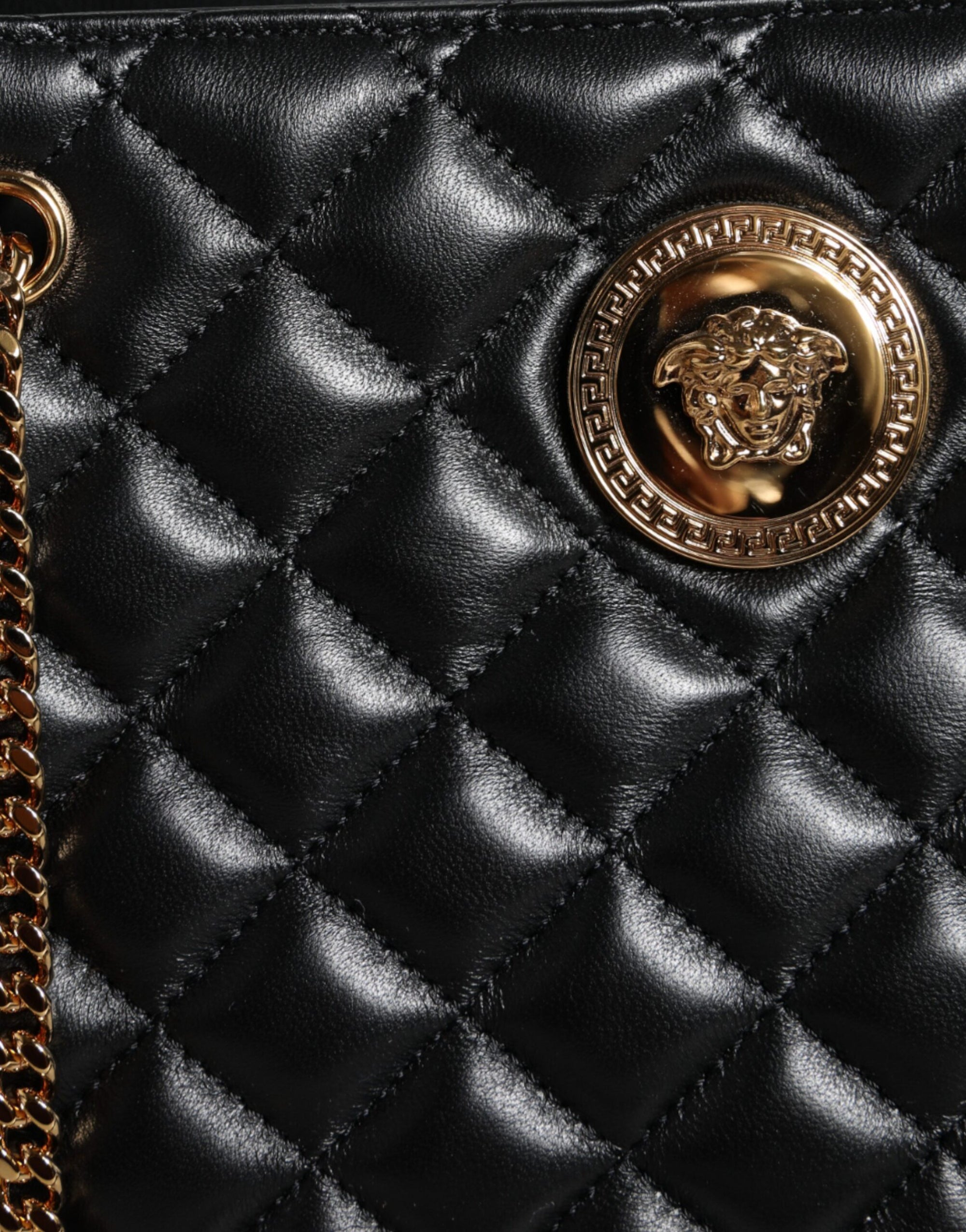 versace-black-quilted-leather-chain-bag-logo-close-up