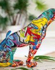 Veelkleurig beeld van zittend jachtluipaard in polyresin